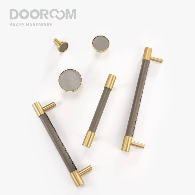 Brass and bronze door handles on a white background with 'DOOROOM' branding.
