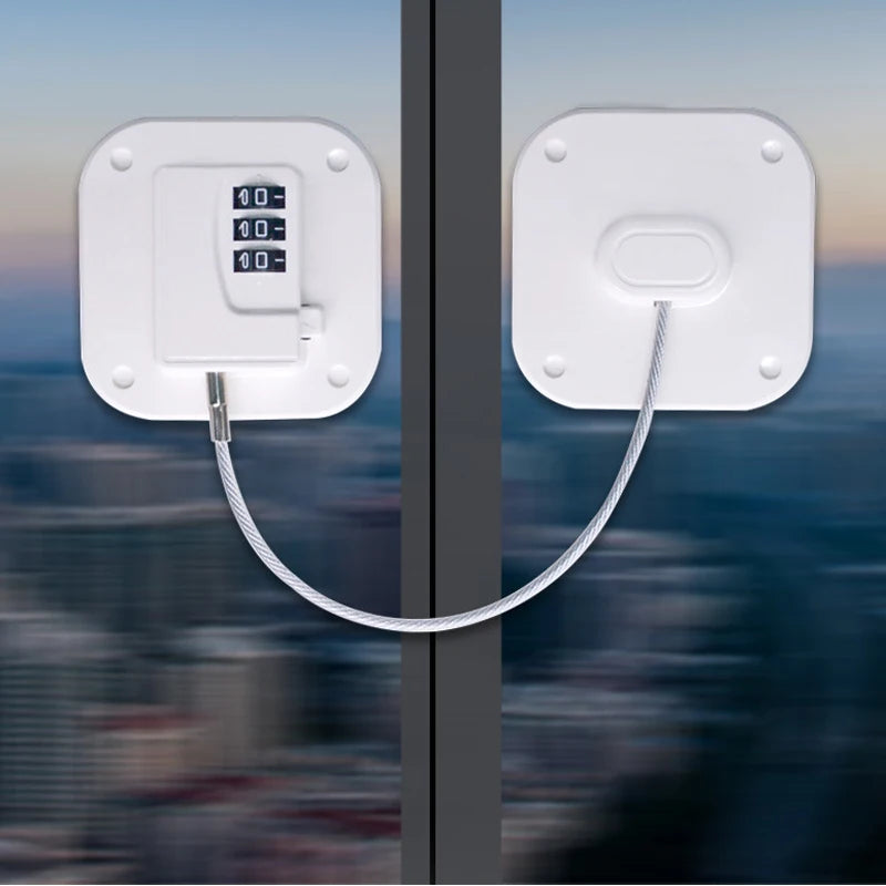 Child safety door and window lock with combination key and cable, shown on a glass surface in a city backdrop.