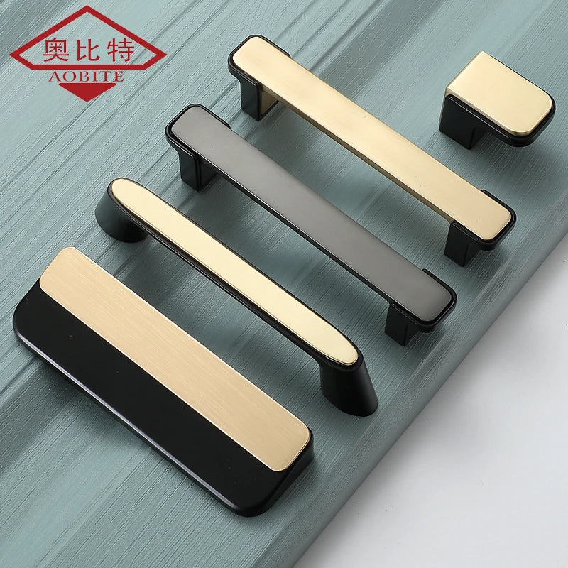 Set of luxury gold and black kitchen cabinet handles and knobs on a teal background.