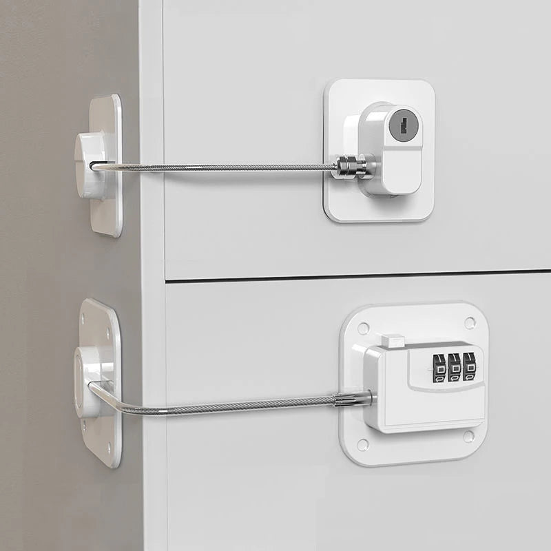 Baby safety lock with combination mechanism on white cabinet drawers for child protection.