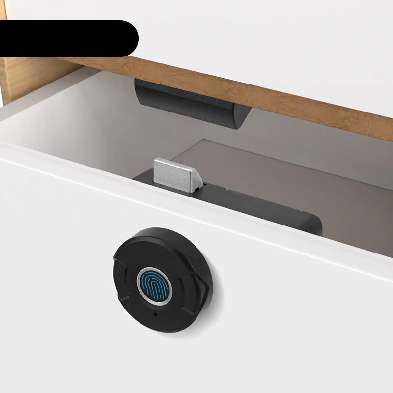 Keyless electric fingerprint lock on a white cabinet drawer, featuring a black circular design with a blue fingerprint icon.
