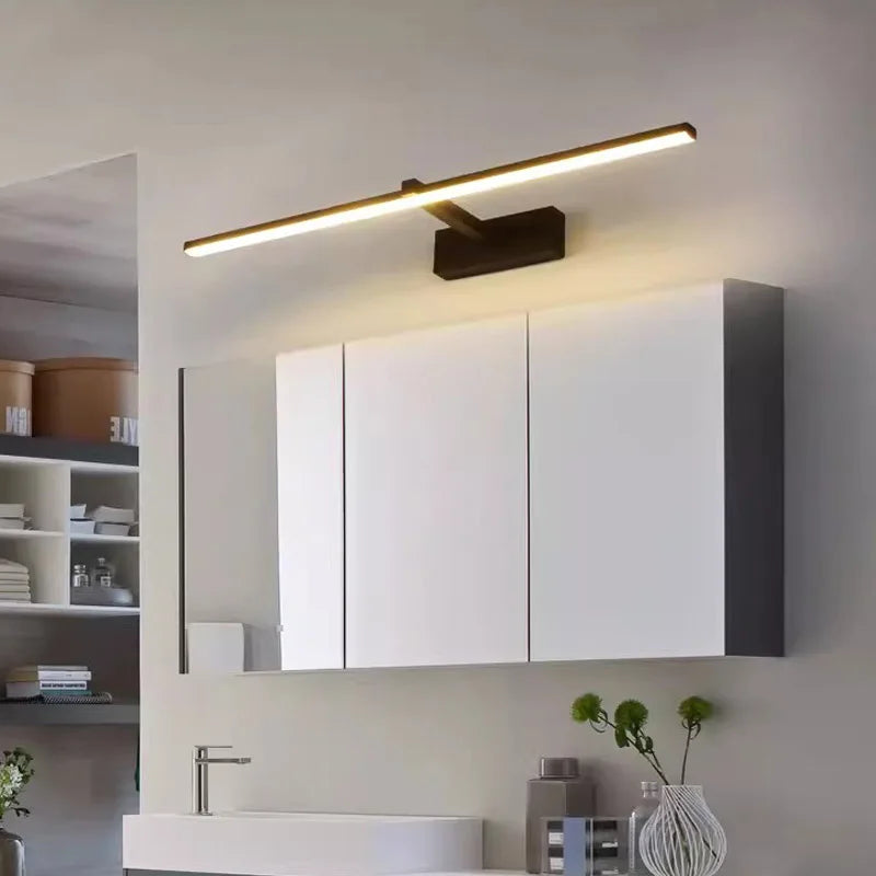 Modern LED wall lamp above bathroom mirror cabinet, waterproof and suitable for makeup lighting.