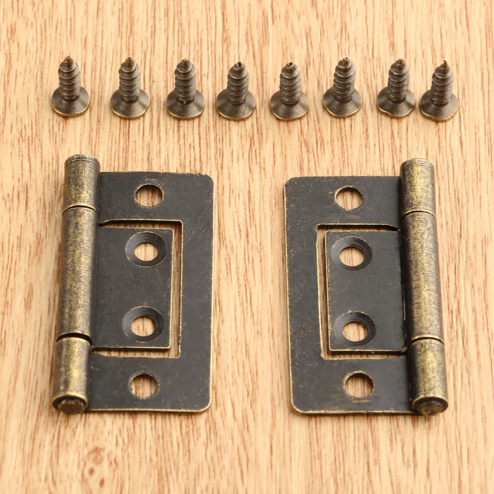 2pcs Vintage Jewelry Wooden Box Decorative Hinges 38x20mm with Screws in Antique Bronze finish on a wood background.