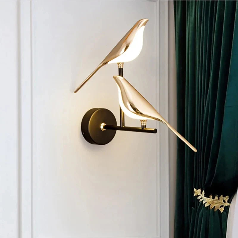 Nordic Golden Bird LED Wall Lights mounted on a white wall with a dark green curtain, ideal for parlor or bedroom decoration.