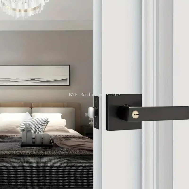 Modern black door handle with square design on white door, leading into a stylish bedroom.