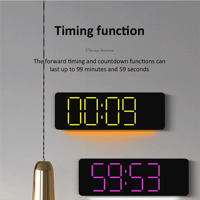 13-inch LED digital alarm clock with countdown timer in yellow and purple on grey wall with decorative gold accent.