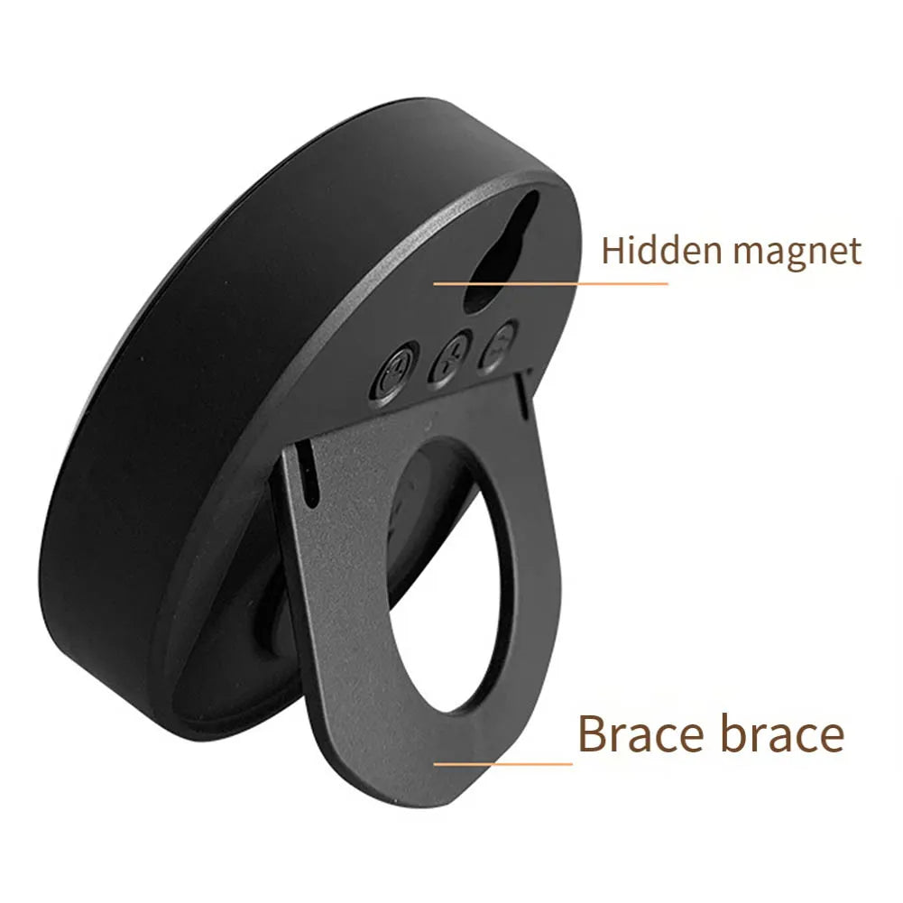 Back view of a multi-function electronic clock with hidden magnet and brace stand, highlighting mounting features.