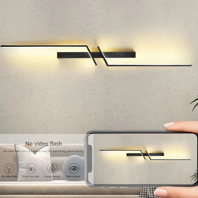 Modern minimalist strip LED wall light with warm glow, ideal for bedroom or living room background, featuring energy-saving and glare control properties.