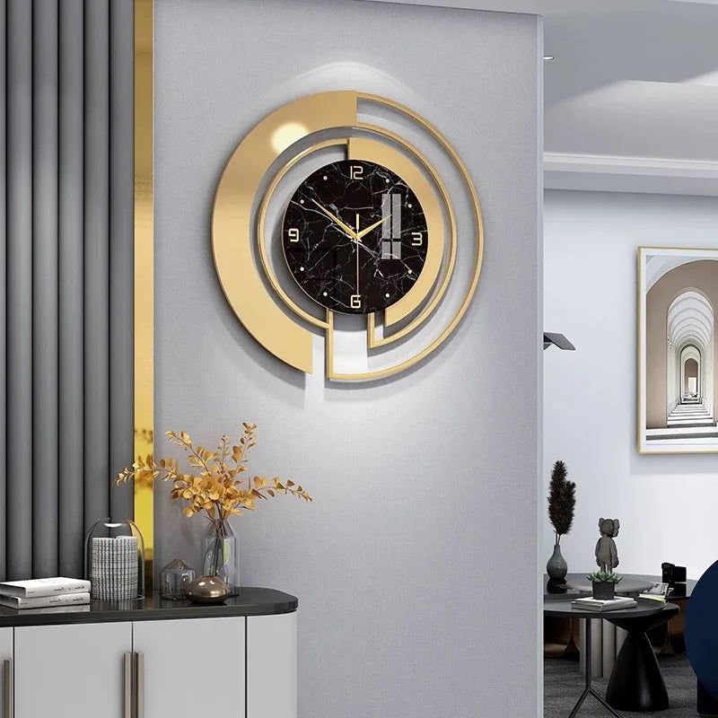Luxury gold and black marble wall clock in a modern living room setting, featuring contemporary design elements.