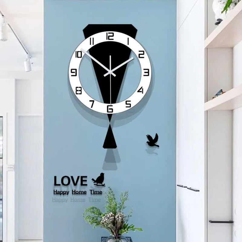 Modern swinging wall clock in black and white with decorative bird and text elements, mounted on a light blue wall in a stylish living room setting.