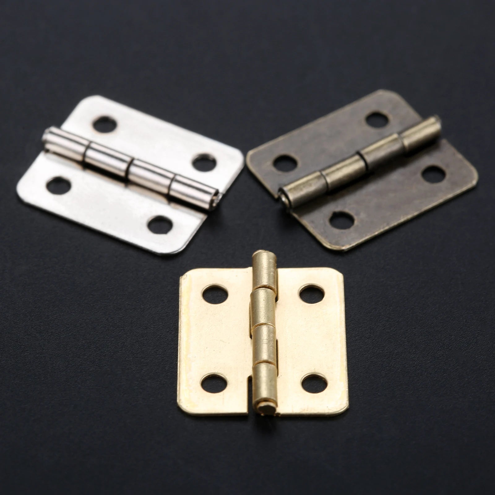 Set of 10 decorative hinges with screws in silver, antique bronze, and gold, 4-hole design, 18x16mm for cabinets and gift cases.