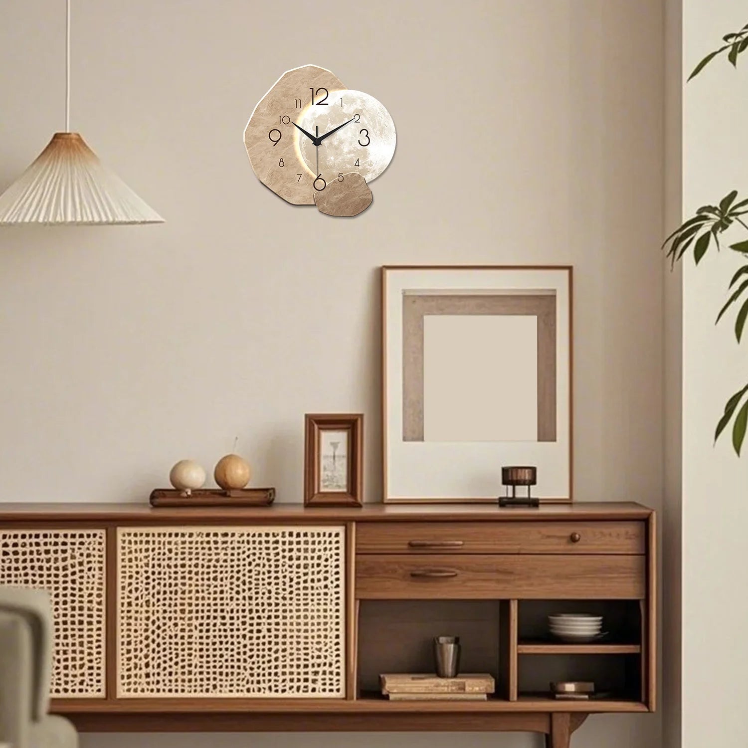 Modern simple silent wall clock with moon design, made of wood, displayed in a stylish living room setting with mid-century decor.