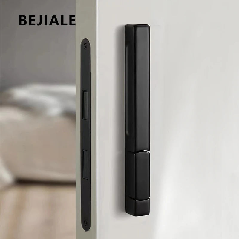 Black single-side invisible lock on a white door with a modern design.