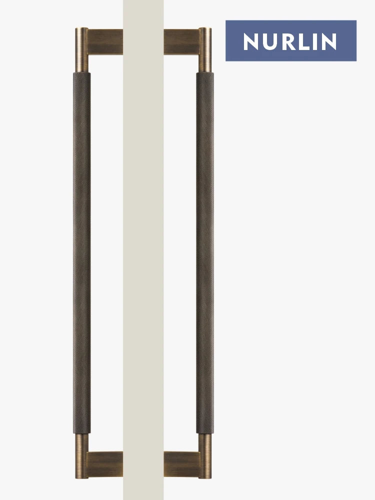 Nurlin solid brass double-sided cross knurled pull bar for kitchen and appliance use, featuring a sleek design and brass accents.