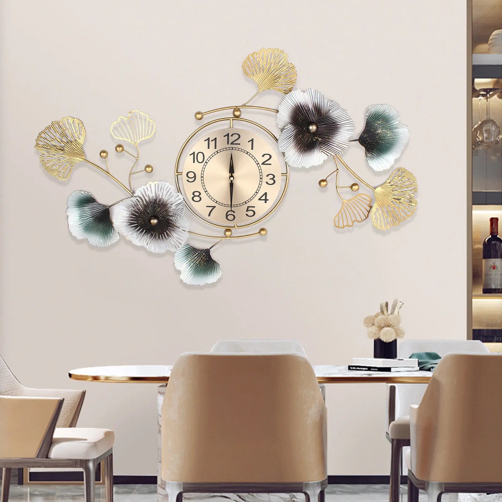Large wall clock with ginkgo leaf design in a modern dining room setting, priced at $178.35.