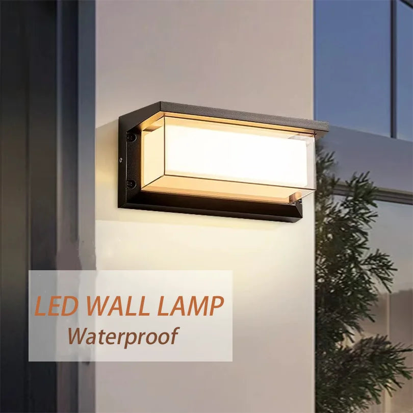 Modern LED wall light with sensor and waterproof design mounted on an exterior wall, emitting a warm glow.