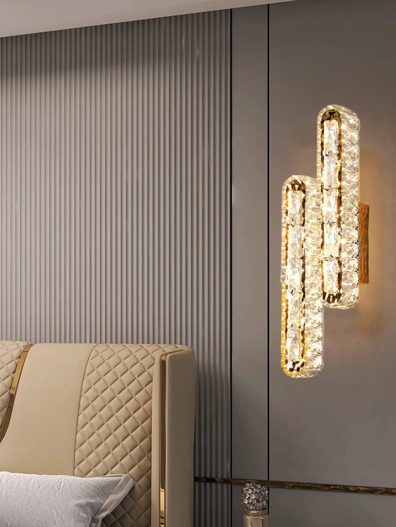 Gold and silver wall lamp with crystal strips for living room or bedside decoration.