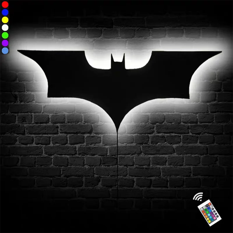 Modern creative wooden wall lamp in bat silhouette with remote control and 16-color options on a brick background.