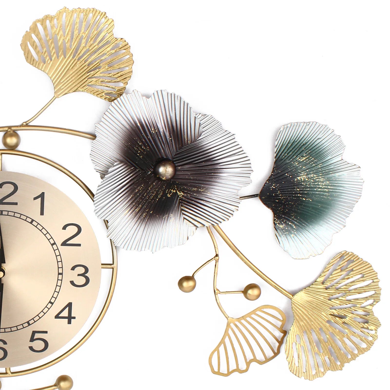 Large wall clock with intricate ginkgo leaf design in metallic gold, silver, and black tones.