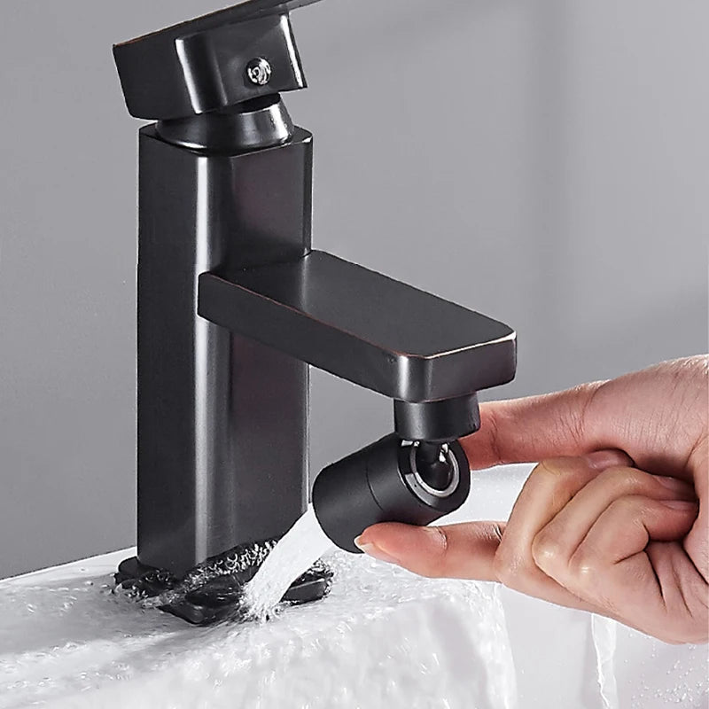 Matte black kitchen faucet with adjustable 360° rotary spray head, shown in use with water flowing.