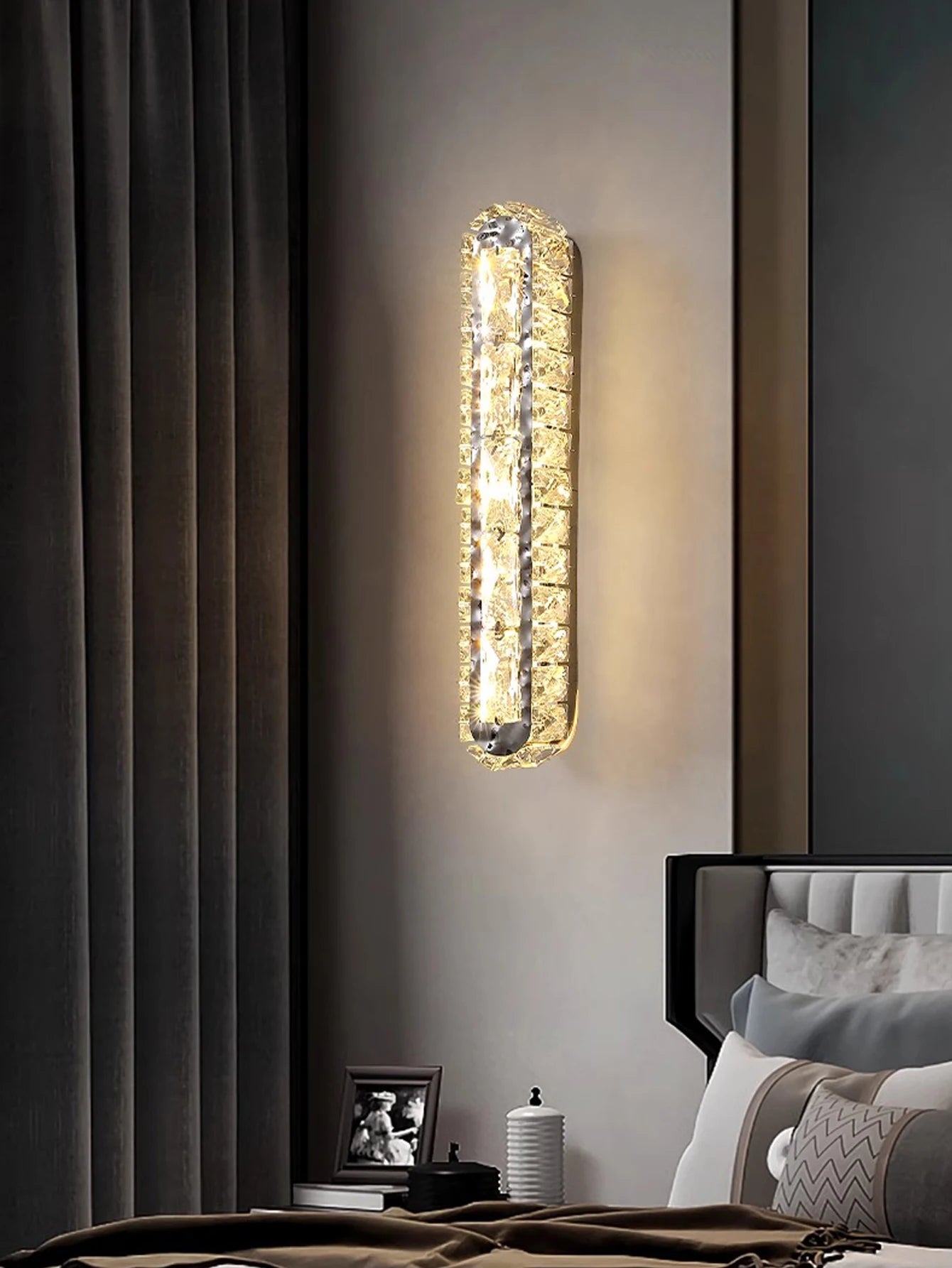 Gold and silver wall lamp with crystal strip, perfect for living room or bedroom decoration.