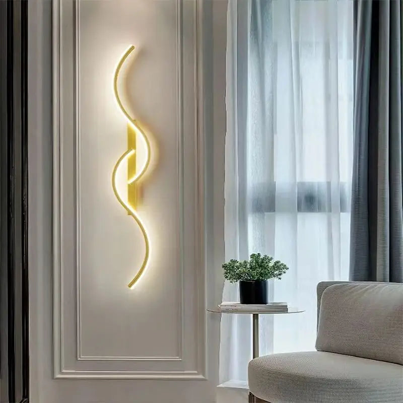 Modern minimalist LED wall lamp with a long strip design in a cozy living room setting, emitting a warm glow.