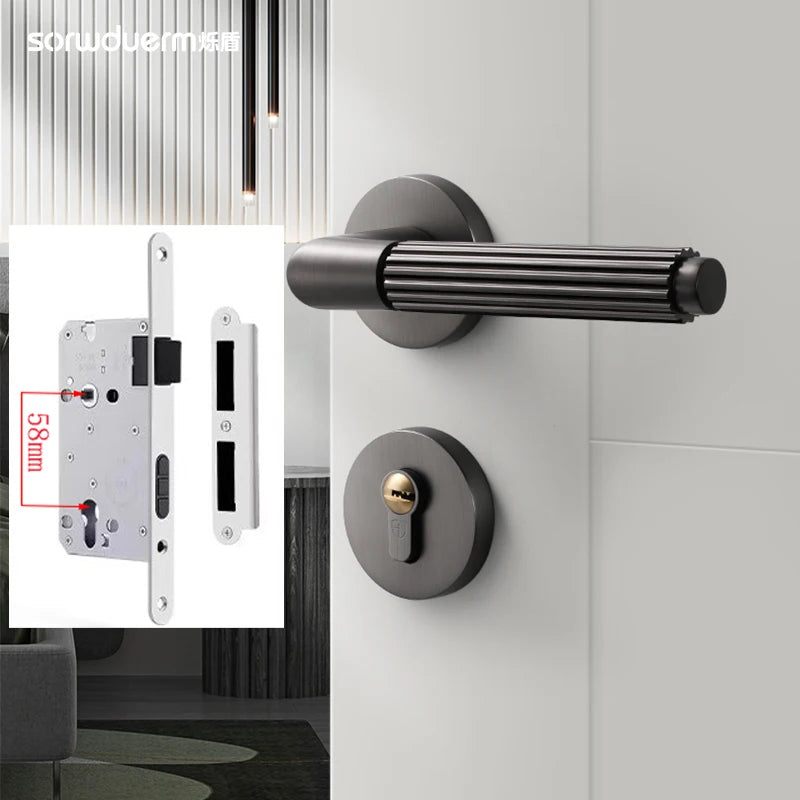 Modern black gray brushed wire bedroom door lock with a split design and textured handle on a wooden door.