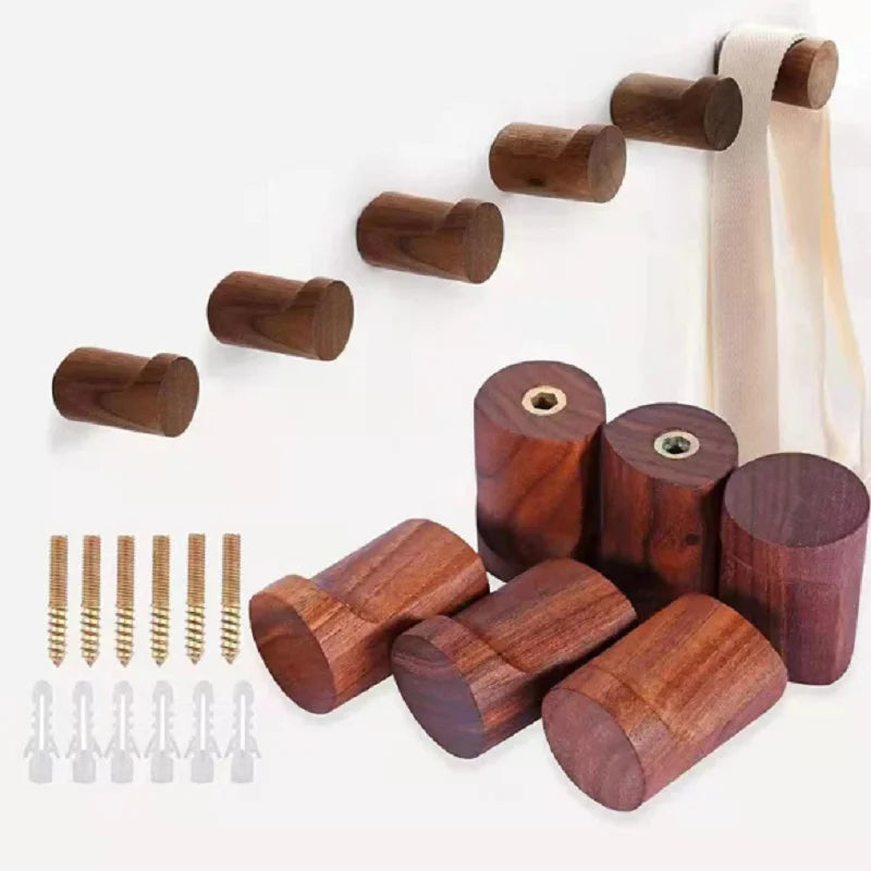Modern minimalist walnut hooks for coats, towels, and keys with installation hardware included.