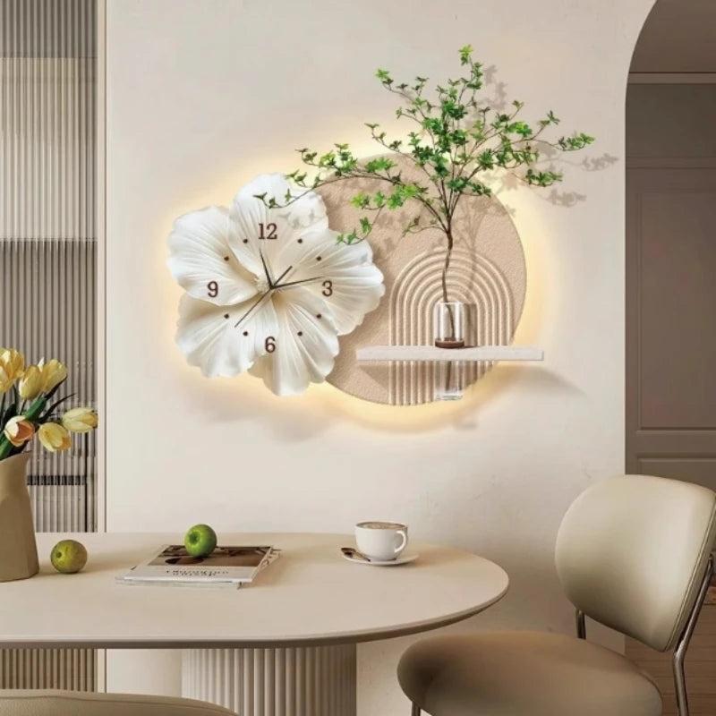 Customized flower-shaped wall clock with a decorative shelf and ambient lighting, featuring a glass vase and faux greenery.