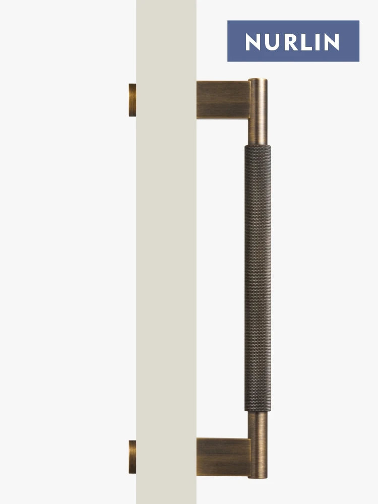 Nurlin solid brass cross knurled pull bar on door, ideal for kitchen refrigerators and closets.