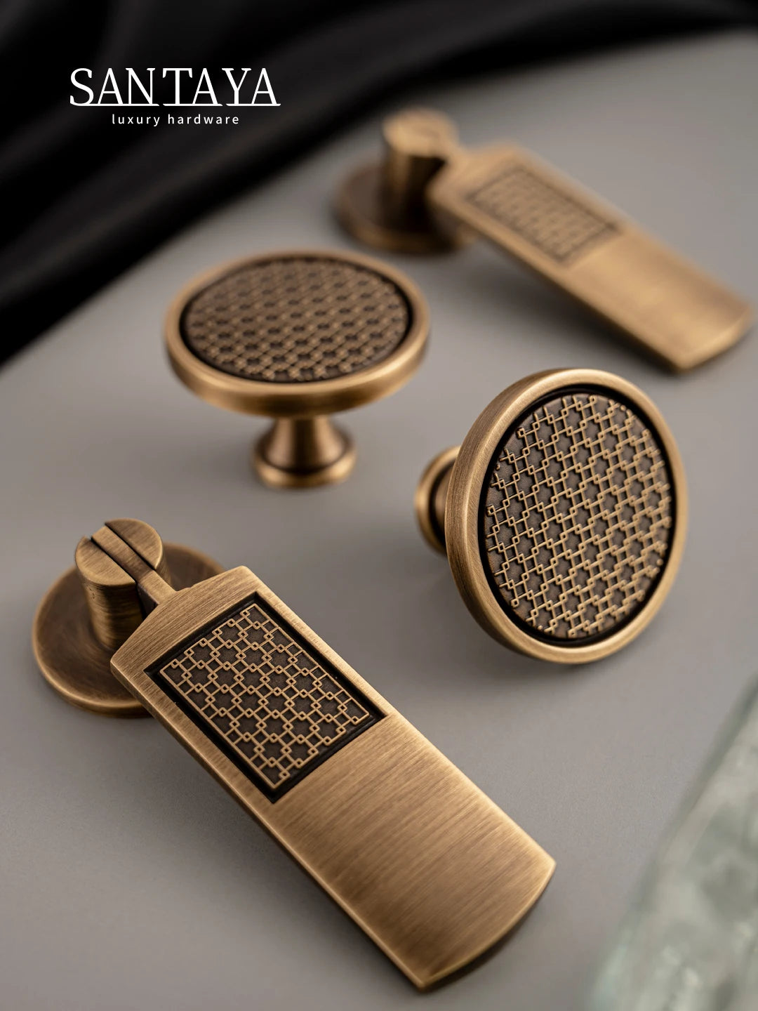 Antique brass handle set featuring luxury bronze cabinet handles and drawer knobs with intricate geometric patterns.