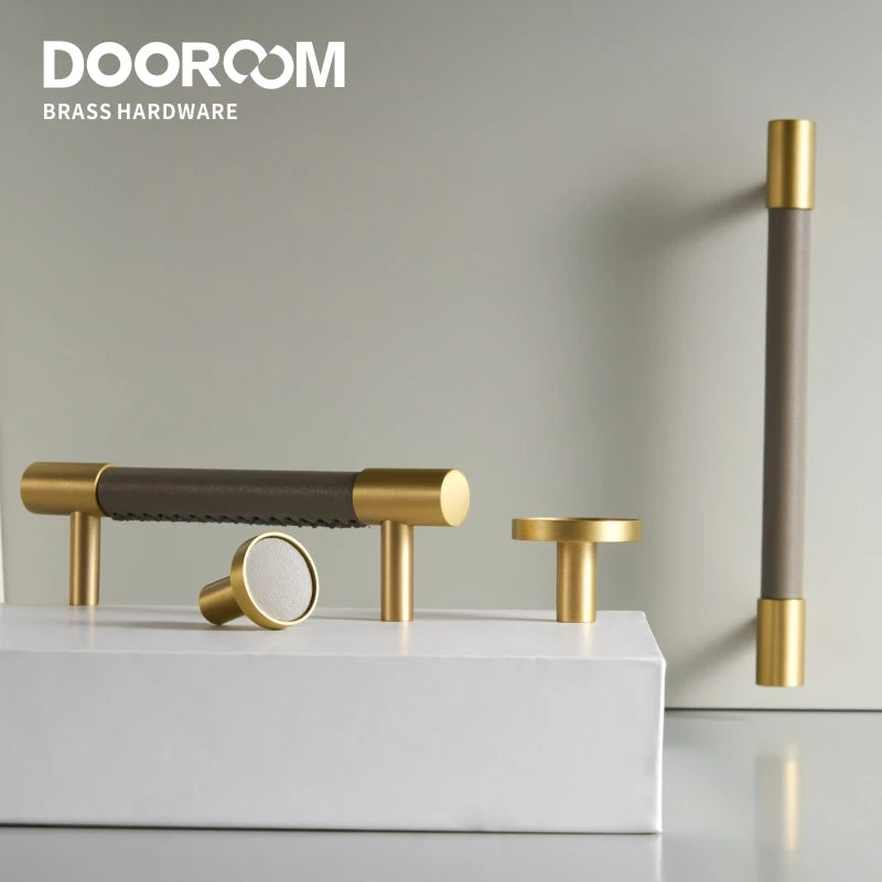 Brass hardware fixtures on a white platform with 'DOOROOM' branding.