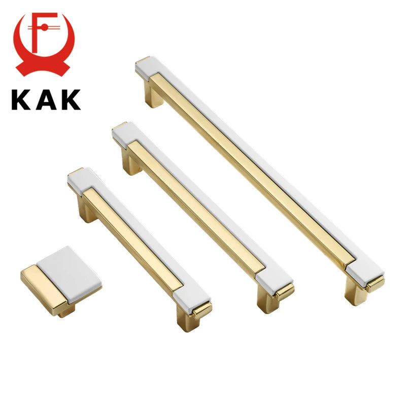 Gold and white cabinet handles with KAK branding on a white background